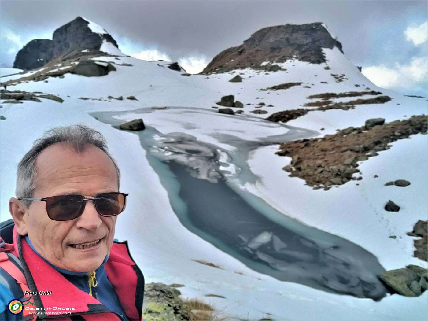 62 Il Piero saluta il laghetto di Pietra Quadra e  scende al Monte Campo in compagnia di bei nuvoloni.jpg